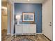 Entryway with decorative console table and blue accent wall at 8930 Tuscany Isles Dr, Punta Gorda, FL 33950