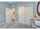 Bedroom with double doors and neutral decor at 8930 Tuscany Isles Dr, Punta Gorda, FL 33950