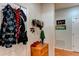 Small coat closet with additional storage and wall decor at 4247 Adelaar Dr, Sarasota, FL 34240