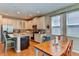 Bright kitchen with white cabinets, granite counters & island at 4247 Adelaar Dr, Sarasota, FL 34240