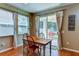 Farmhouse style dining area with sliding glass doors to backyard at 4247 Adelaar Dr, Sarasota, FL 34240