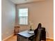 Home office with desk, chair, and window with blinds at 4247 Adelaar Dr, Sarasota, FL 34240