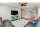 Spacious living area with leather seating and hardwood floors at 4247 Adelaar Dr, Sarasota, FL 34240