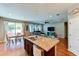 Island kitchen with granite countertops and stainless steel appliances at 4247 Adelaar Dr, Sarasota, FL 34240