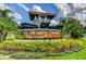 Palmer Reserve community entrance with landscaping and signage at 4247 Adelaar Dr, Sarasota, FL 34240