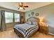 Spacious bedroom with a wooden bed frame and checkered bedding at 4247 Adelaar Dr, Sarasota, FL 34240