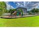 Community playground with modern equipment for children at 4247 Adelaar Dr, Sarasota, FL 34240