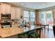 Kitchen boasts granite countertops, island, and stainless steel appliances at 4247 Adelaar Dr, Sarasota, FL 34240