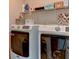 Laundry room with side-by-side washer and dryer, and shelving at 4247 Adelaar Dr, Sarasota, FL 34240