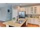 Spacious kitchen with granite countertops, stainless steel appliances, and white cabinets at 4247 Adelaar Dr, Sarasota, FL 34240