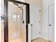 Walk-in shower with glass enclosure and beige tile surround at 4247 Adelaar Dr, Sarasota, FL 34240