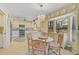 Charming kitchen breakfast nook with chandelier and view to backyard at 5133 Wedge E Ct, Bradenton, FL 34203