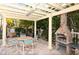 Outdoor patio with seating area and built-in grill, perfect for entertaining at 7324 Gulf Dr # 12, Holmes Beach, FL 34217