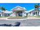Elegant clubhouse entrance with landscaping at 10434 Spring Tide Way, Parrish, FL 34219