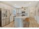 Modern kitchen with white cabinets, quartz countertops, and stainless steel appliances at 10434 Spring Tide Way, Parrish, FL 34219