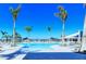 Inviting resort-style pool with lounge chairs and umbrellas at 10434 Spring Tide Way, Parrish, FL 34219