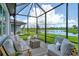 Enjoy serene lake views from this covered patio at 10434 Spring Tide Way, Parrish, FL 34219