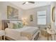 Guest bedroom with a queen-size bed and calming decor at 10434 Spring Tide Way, Parrish, FL 34219
