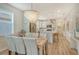 Elegant dining room with a stylish chandelier and adjacent kitchen at 10434 Spring Tide Way, Parrish, FL 34219