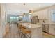 Modern kitchen with white cabinets, quartz countertops, and stainless steel appliances at 10434 Spring Tide Way, Parrish, FL 34219