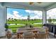 Relaxing screened patio overlooking a tranquil lake at 10434 Spring Tide Way, Parrish, FL 34219