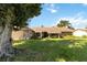 Single-story home with stone exterior and landscaped yard at 4607 Masefield Pl, Sarasota, FL 34241