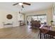Spacious living room featuring hardwood floors and sliding glass doors leading to patio at 4607 Masefield Pl, Sarasota, FL 34241