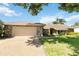Single-story home with stone exterior and attached garage at 4607 Masefield Pl, Sarasota, FL 34241