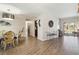 Bright dining room with hardwood floors and view to the pool at 4607 Masefield Pl, Sarasota, FL 34241