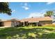 Single-story home with stone exterior and landscaped yard at 4607 Masefield Pl, Sarasota, FL 34241