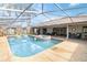 Enclosed pool area with spa and plenty of seating for relaxation at 4607 Masefield Pl, Sarasota, FL 34241