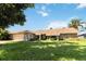 Single-story home with stone exterior and landscaped yard at 4607 Masefield Pl, Sarasota, FL 34241