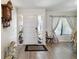 Inviting entryway with tile flooring, featuring a white door and charming decor at 4607 Masefield Pl, Sarasota, FL 34241