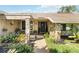 Inviting exterior with stone accents and landscaped walkway at 4607 Masefield Pl, Sarasota, FL 34241