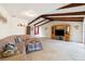 Bright living room with high ceilings, exposed beams and comfortable furniture at 4607 Masefield Pl, Sarasota, FL 34241