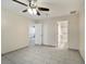 Large bedroom with tile floors, ceiling fan, and access to bathroom and another bedroom at 3712 3Rd W Ave, Palmetto, FL 34221