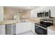 Open kitchen with stainless steel appliances and breakfast bar at 3712 3Rd W Ave, Palmetto, FL 34221