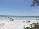 Stunning beach view with white sand and clear water, perfect for relaxation at 3712 3Rd W Ave, Palmetto, FL 34221
