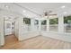 Sunroom with wood-look flooring and lots of windows at 3712 3Rd W Ave, Palmetto, FL 34221