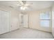 Simple bedroom with tile floors, ceiling fan, and double door closet at 3712 3Rd W Ave, Palmetto, FL 34221
