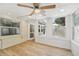 Sunroom with wood-look flooring and multiple windows at 3712 3Rd W Ave, Palmetto, FL 34221