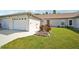 Exterior view of villa with garage and landscaping at 3712 3Rd W Ave, Palmetto, FL 34221