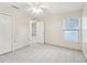 Simple bedroom with tile floors, ceiling fan, and double door closet at 3712 3Rd W Ave, Palmetto, FL 34221