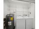 Laundry room with washer, dryer, and hot water heater at 3712 3Rd W Ave, Palmetto, FL 34221