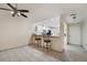 Bright dining area with kitchen access and two barstools at 3712 3Rd W Ave, Palmetto, FL 34221