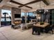 Relaxing outdoor patio with fireplace and dining area at 1158 Blue Shell Loop, Sarasota, FL 34240