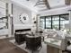 Spacious living room with fireplace, large windows, and comfortable seating at 1158 Blue Shell Loop, Sarasota, FL 34240