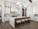 Modern kitchen with white cabinets, large island, and high-end appliances at 1158 Blue Shell Loop, Sarasota, FL 34240