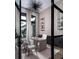 Bright home office with built-in shelving and large windows at 1158 Blue Shell Loop, Sarasota, FL 34240