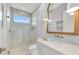 Bathroom with a frameless glass shower and quartz countertop at 11414 Brightly Dr, Venice, FL 34293